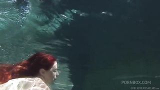 Busty redhead MILF Penny Pax has her pussy eaten by brunette beauty Belle Noire