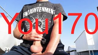 you want to watch this guy jerk off his big dick and bring himself to orgasm in a public place