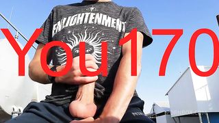 you want to watch this guy jerk off his big dick and bring himself to orgasm in a public place