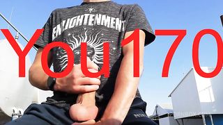 you want to watch this guy jerk off his big dick and bring himself to orgasm in a public place