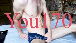 The guy shows off his athletic body, his abs, and jerks off a big uncircumcised cock