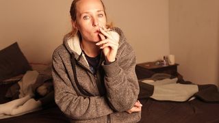 SMOKING AND STARING AT THE CAMERA