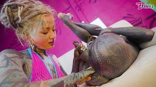 TATTOOED DOMINATRIX IN PINK FISHNET