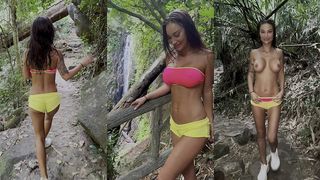 MONIKA FOX IN PINK TOP AND YELLOW SHORTS WALKS THROUGH JUNGLE AND WATERFALLS