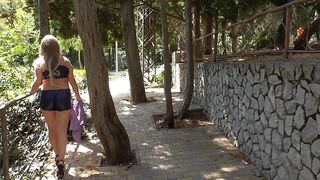 I M WALKING AROUND THE CITY IN A PAINTED SWIMSUIT.