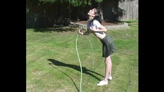 ZOE PLAYS WITH WATER HOSE WETTING PIERCED TITS & HER PUSSY