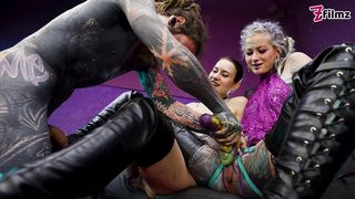 HEAVY TATTOOED SUB PLAYED WITH AND PEGGED BY 2 DOMINAS