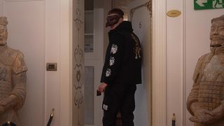 A STRANGE GUY IN A MASK LURED INTO A COZY ROOM