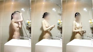 JAPANESE GIRL’S DAILY BATHING AT HOME.