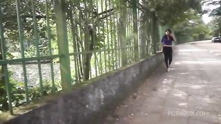 A shemale brunette with leggings walking on the street, maybe we can pick her up