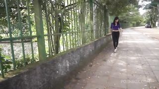A shemale brunette with leggings walking on the street, maybe we can pick her up