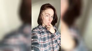 Your girlfriend with glasses fingering her wet pussy