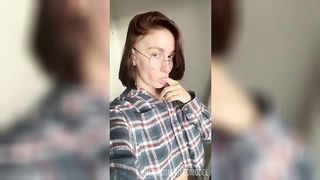 Your girlfriend with glasses fingering her wet pussy