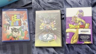 MY ENTIRE DVD COLLECTION AND SOME OF THE BOOKS I OWN