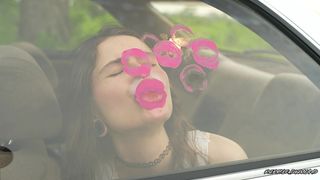 MESSY PINK LIPGLOSS MARKS ON THE CAR WINDOW