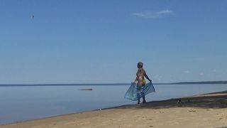 MY WIFE IS ON THE BEACH IN A YELLOW BIKINI