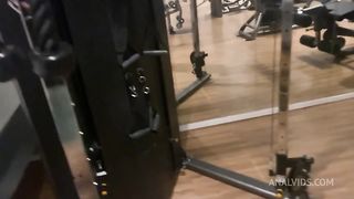 Naughty redhead was surprised at the gym by her friend and fell head over heels before being fucked