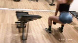 Naughty redhead was surprised at the gym by her friend and fell head over heels before being fucked