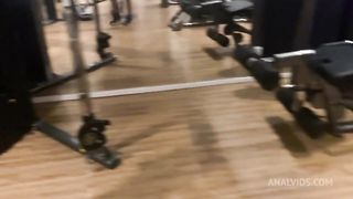 Naughty redhead was surprised at the gym by her friend and fell head over heels before being fucked