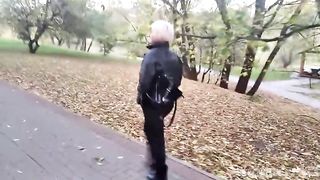 A mature woman with a camera walks about the park, and no one even guesses that she is a famous whore .!. ))