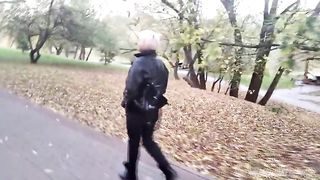 A mature woman with a camera walks about the park, and no one even guesses that she is a famous whore .!. ))