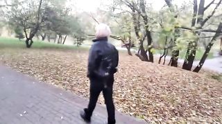 A mature woman with a camera walks about the park, and no one even guesses that she is a famous whore .!. ))