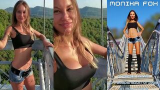 MONIKA FOX POSES AND FLASHES BOOBS ON A SUSPENSION BRIDGE IN THE MOUNTAINS