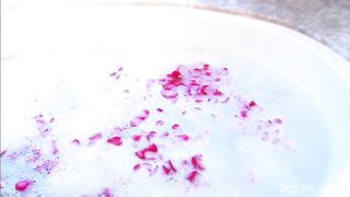 Steamy session with blond and dude in sudsy and rose petal filled tub.