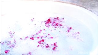 Steamy session with blond and dude in sudsy and rose petal filled tub.