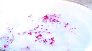 Steamy session with blond and dude in sudsy and rose petal filled tub.