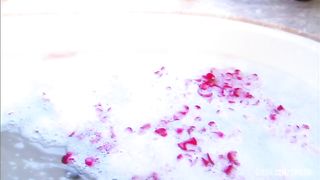 Steamy session with blond and dude in sudsy and rose petal filled tub.