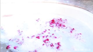 Steamy session with blond and dude in sudsy and rose petal filled tub.