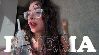 A GIRL WITH A SPLIT TONGUE GIVES HERSELF AN ENEMA ON CAMERA.