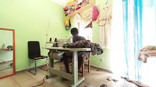 The seamstress with her client in the Sewing workshop whos to take the measurements of pants to take the measurements of the cock in public