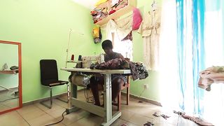 The seamstress with her client in the Sewing workshop whos to take the measurements of pants to take the measurements of the cock in public