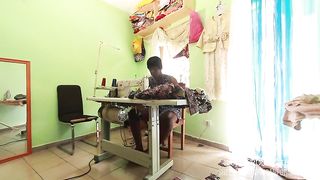 The seamstress with her client in the Sewing workshop whos to take the measurements of pants to take the measurements of the cock in public