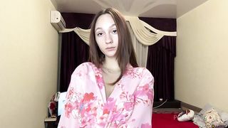 cute girl in a robe fucking her pussy close-up and cumming