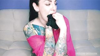 Tattooed hottie with a big ass takes her panties in her mouth and slaps her fucking ass